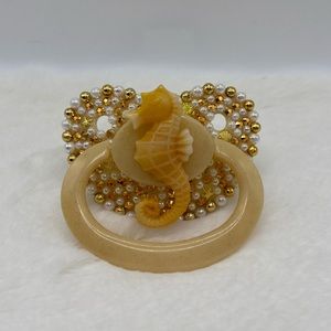Gold sea horse adult pacifier